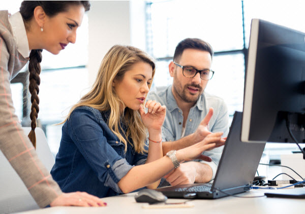 Group of business people and software developers working as a team in office